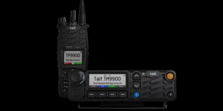 The Tait TP9900 handheld radio and TM9900 mobile radio shown together, both featuring multiprotocol and multiband displays, against a black background.