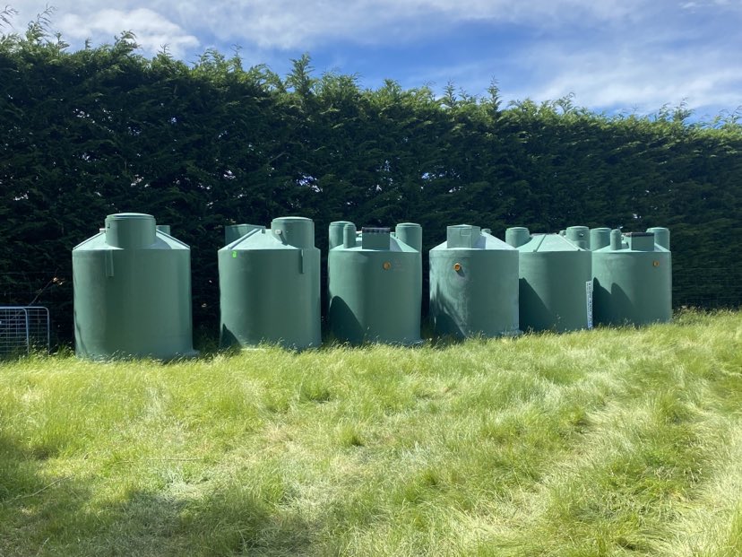 plastic septic tanks on grass field