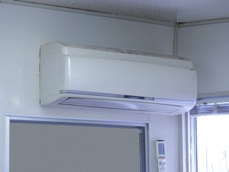 A wall-mounted heat pump unit installed inside a home providing efficient heating and cooling.