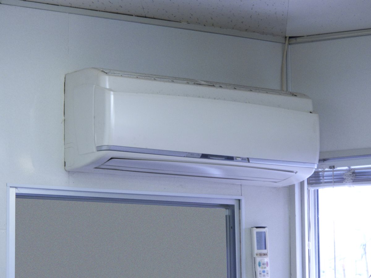 A wall-mounted heat pump unit installed inside a home providing efficient heating and cooling.
